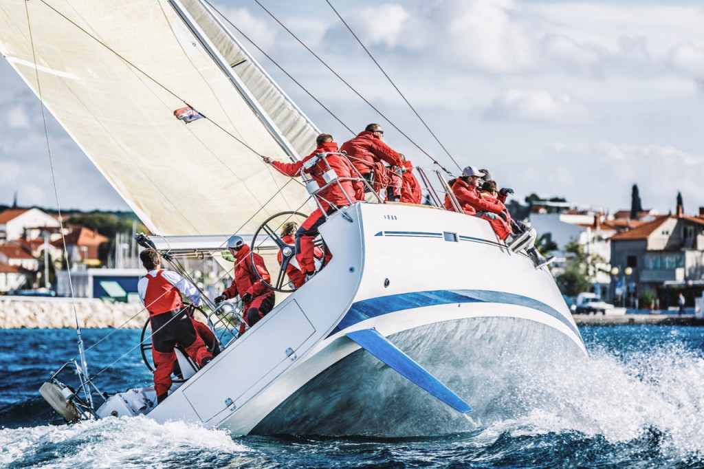 Sailing racing crew on sailboat during regatta